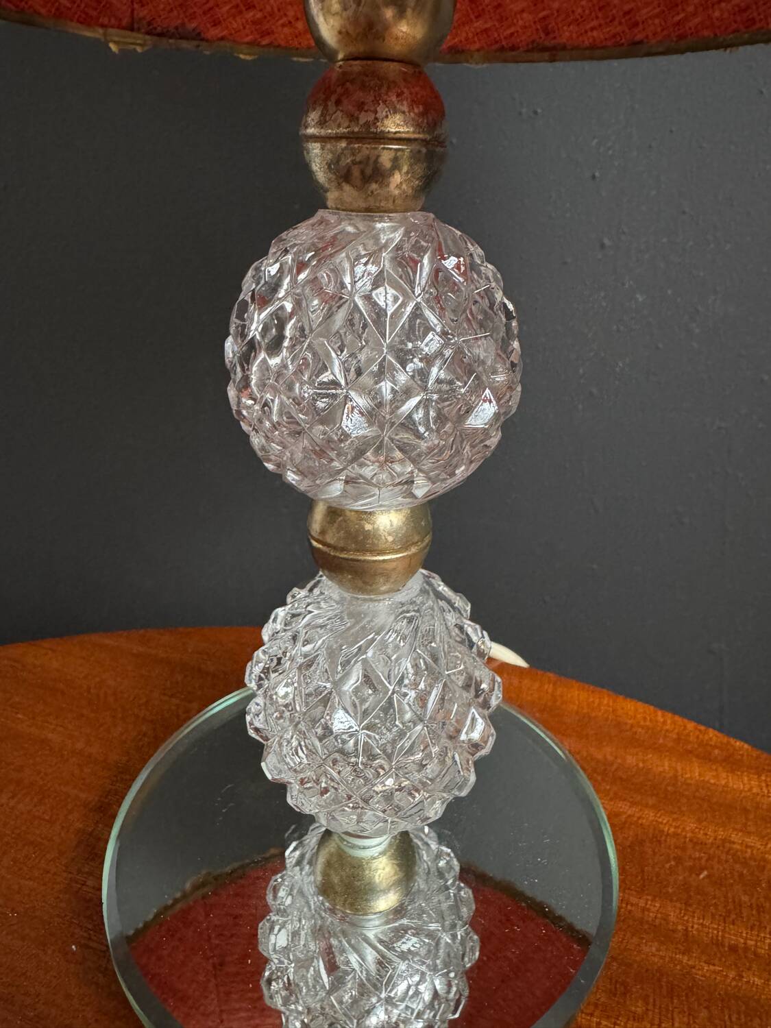 Small glass, mirror, and brass lamp from the 1960s.