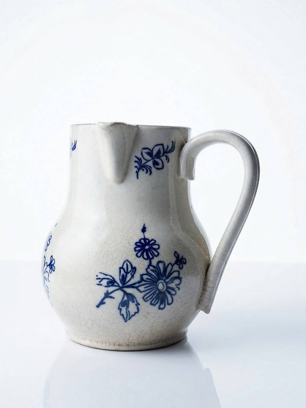 Fine earthenware pitcher with blue decoration, attributed to Saint-Uze, 19th century.