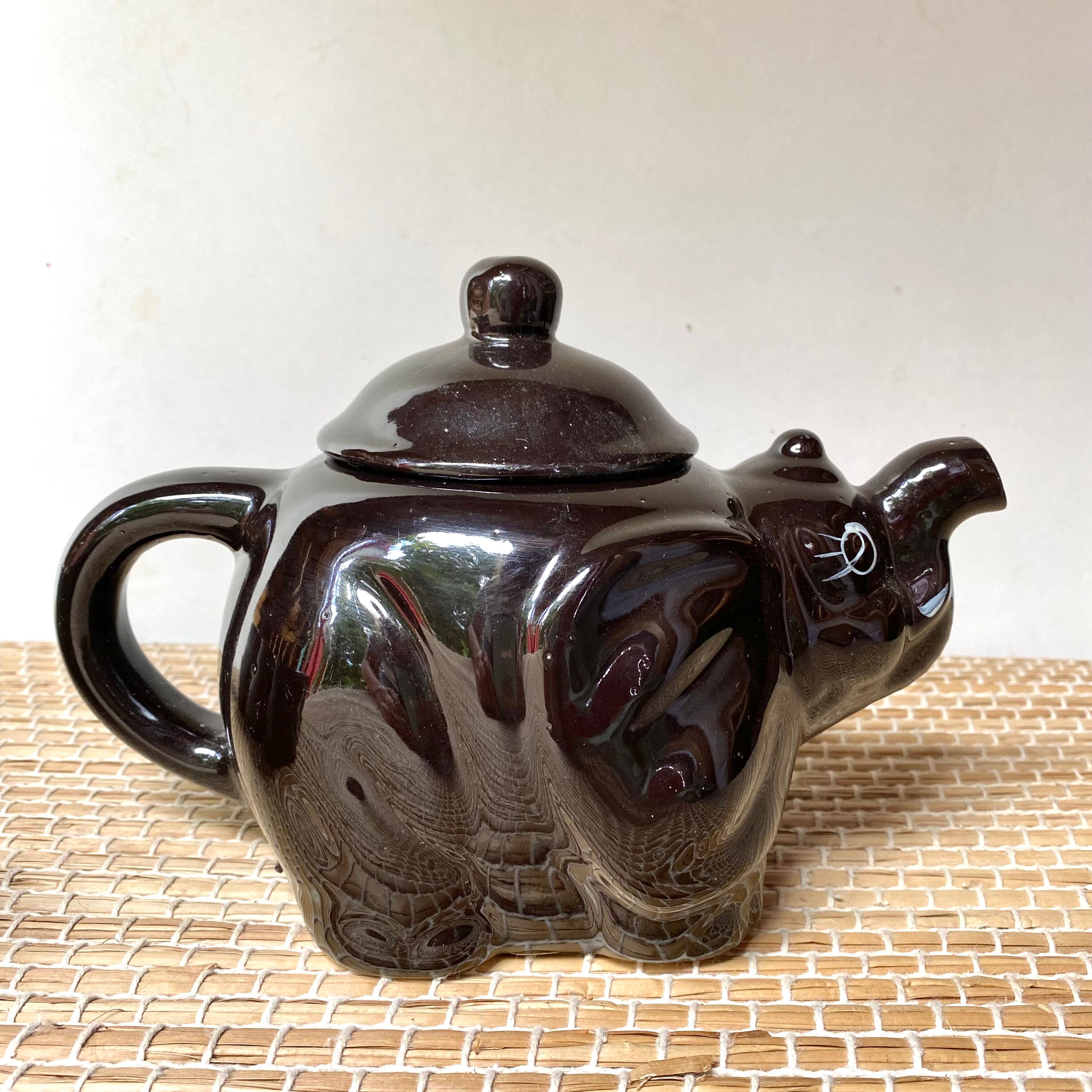Vintage teapot and vintage elephant cups