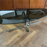70s design oval coffee table in smoked black glass with chrome legs.