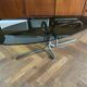 Table basse design ovale années 70 en verre fumé noir et pieds chromé