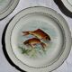 Set of 6 vintage Limoges porcelain plates with fish design.