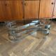 70s design oval coffee table in glass with chrome legs.