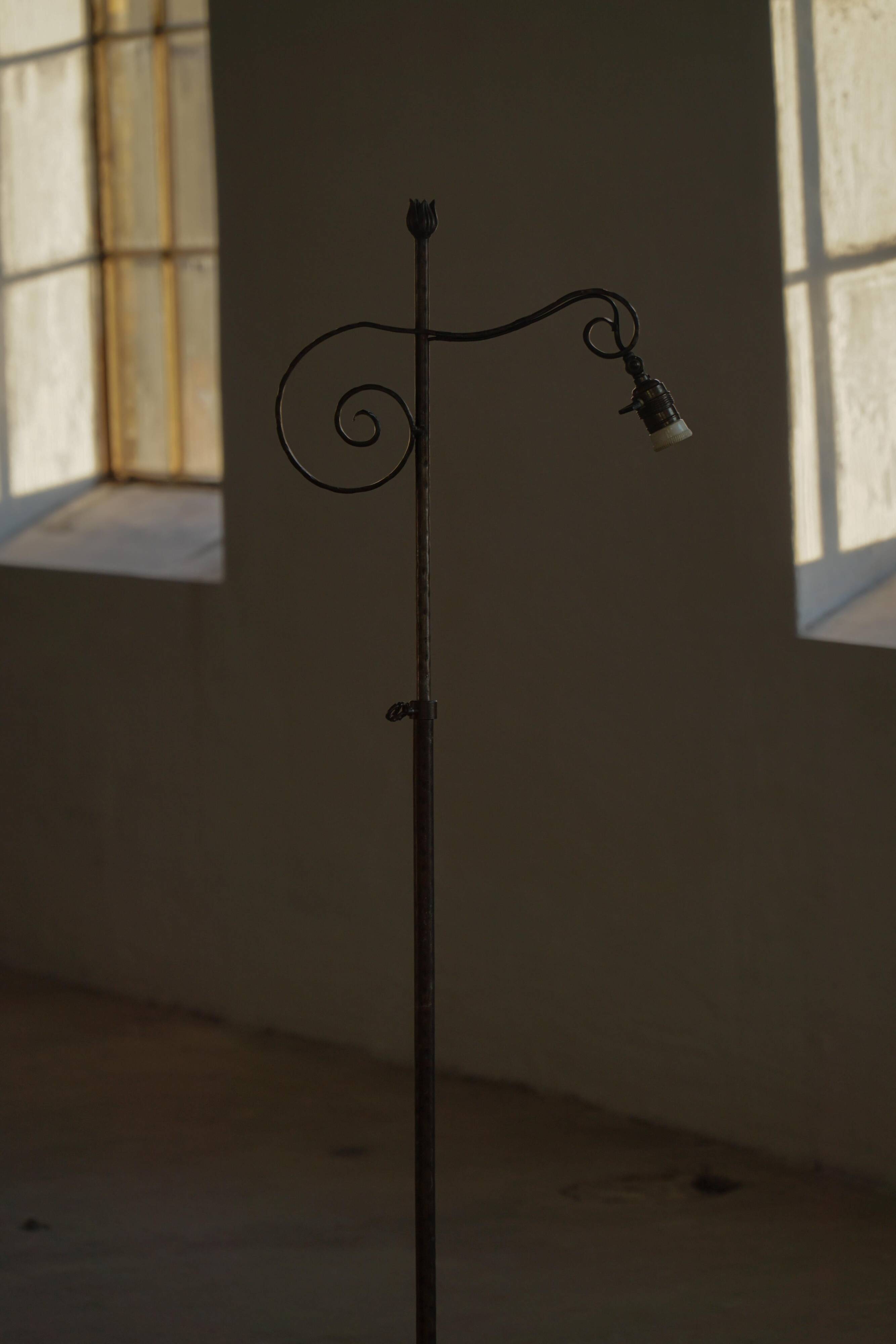 20th-century wrought iron floor lamp with swirling detail, Danish Art Deco.