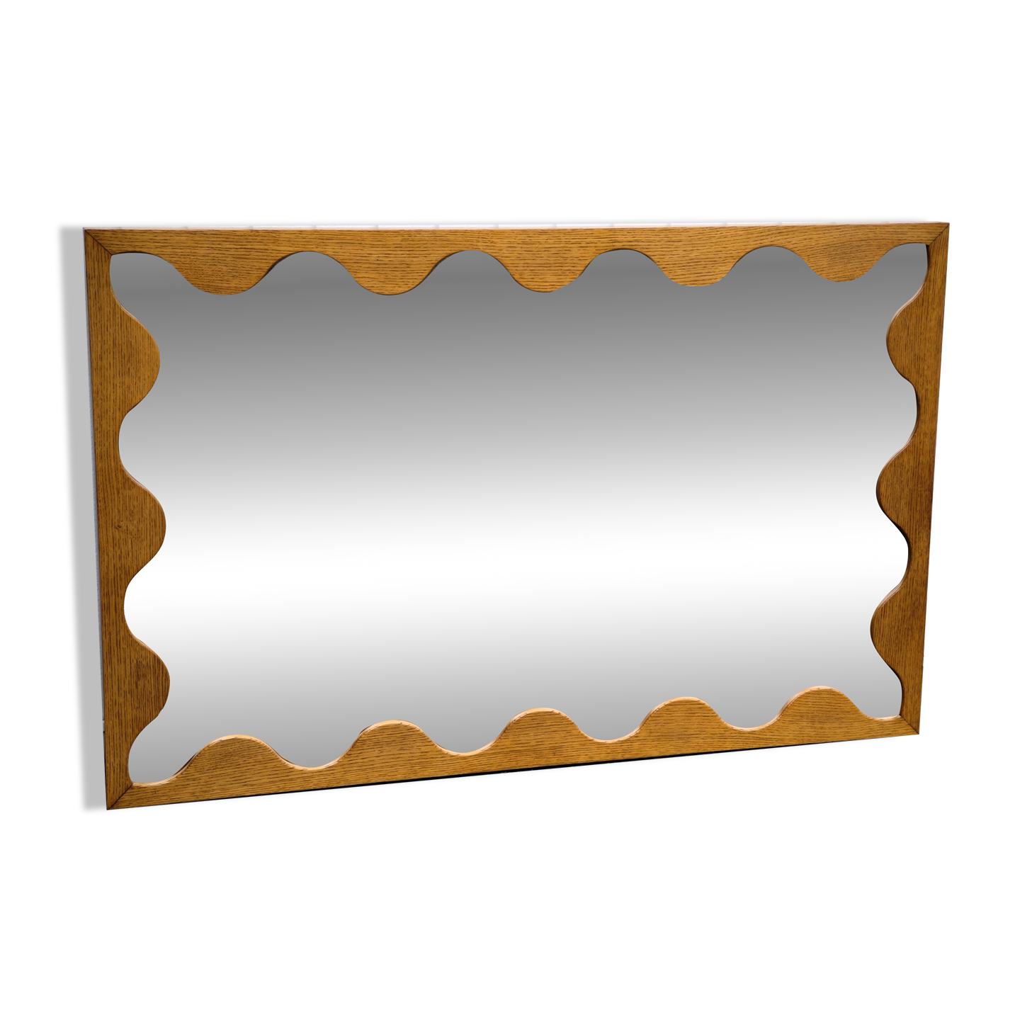 Large antique mirror with an oak frame.