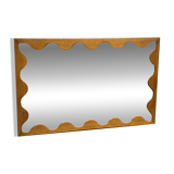 Large antique mirror with an oak frame.