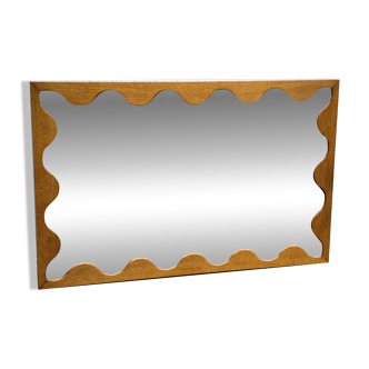 Large antique mirror with an oak frame.