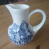 Small old pitcher in iron earth