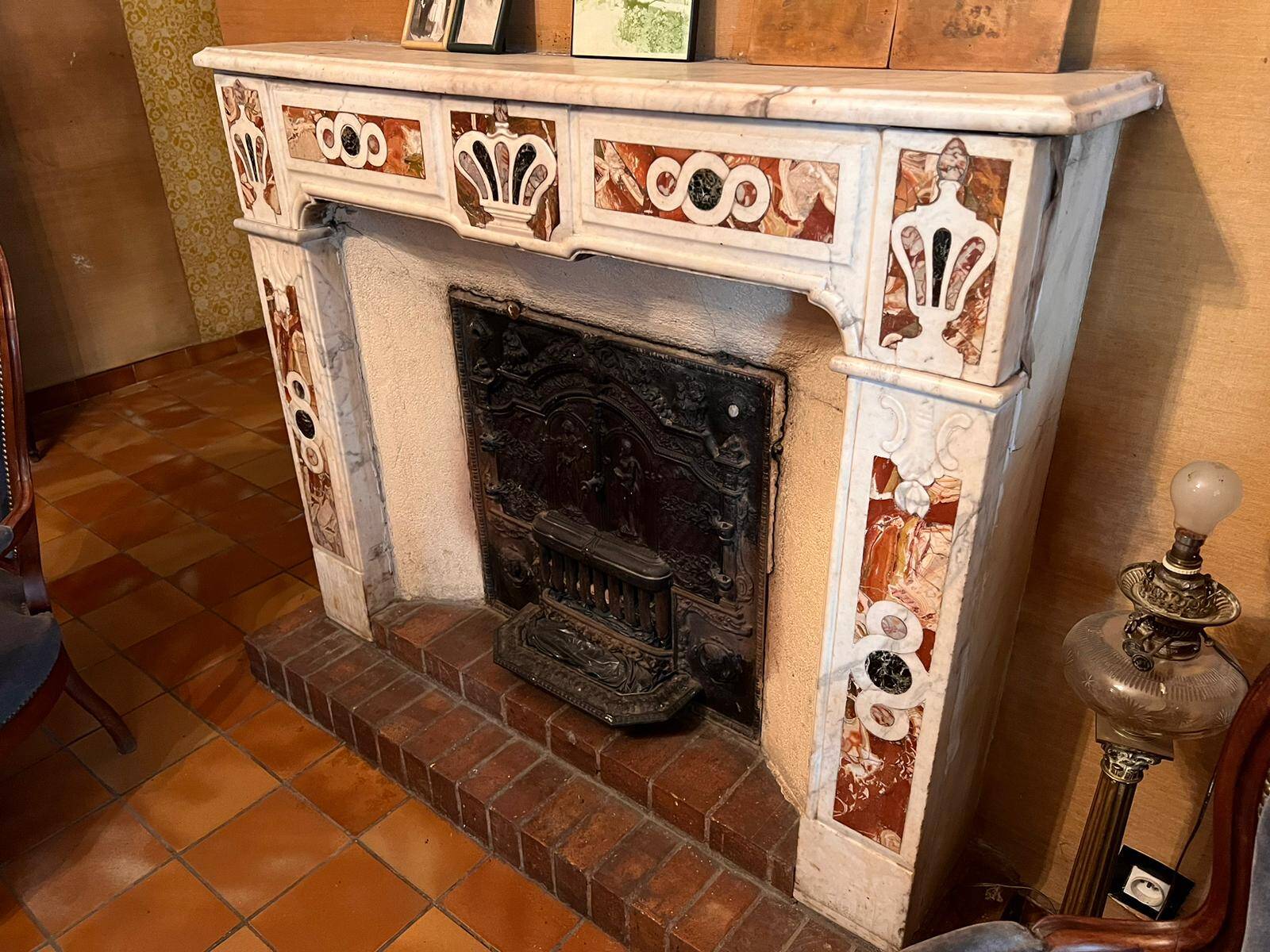 Carrara marble fireplace with 18th century incrustations