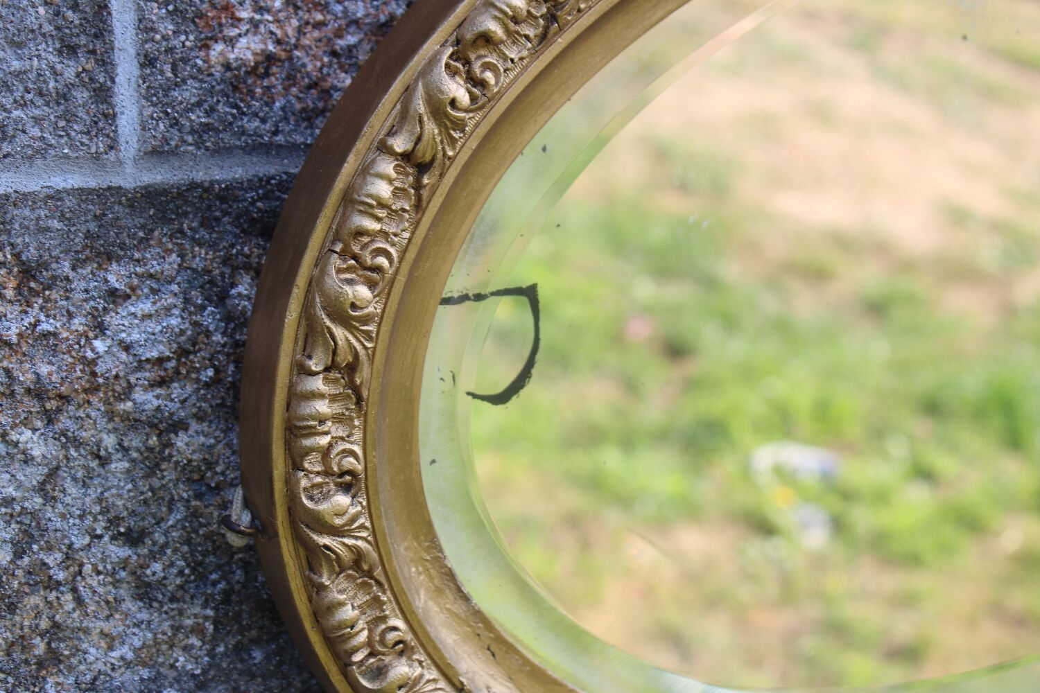 Bevelled oval antique mirror