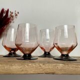 4 pink glasses with black stems