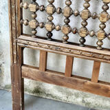 Carved wooden headboard