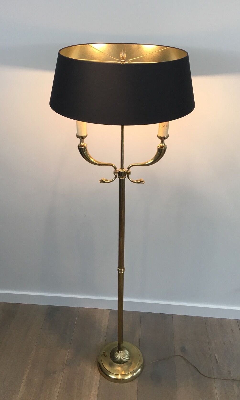 Floor lamp of parquet in neoclassical style in brass with dolphin heads
