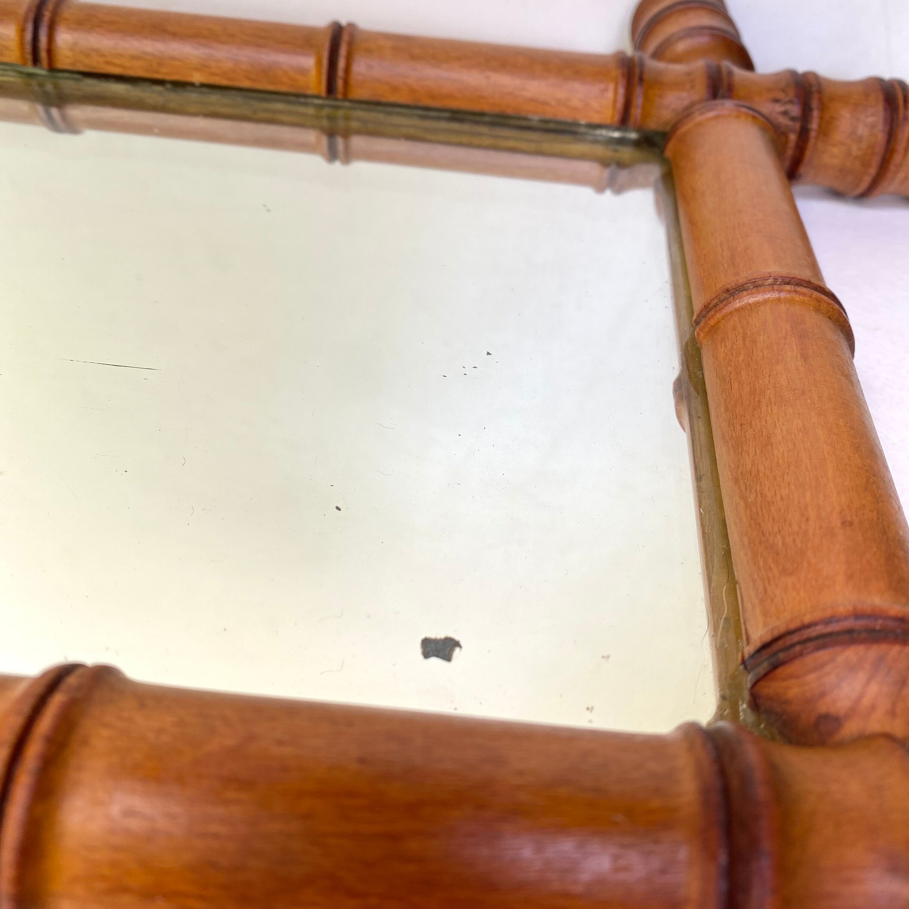 Antique mercury mirror in bamboo-style wood