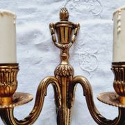 French Empire-style wall sconce or chandelier in bronze with an antique gold patina.