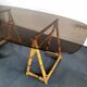 1970s dining table with bamboo trestle legs and smoked glass