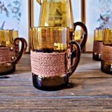 Orangeade set with pitcher and 6 amber glass glasses with "woven" fabric surround