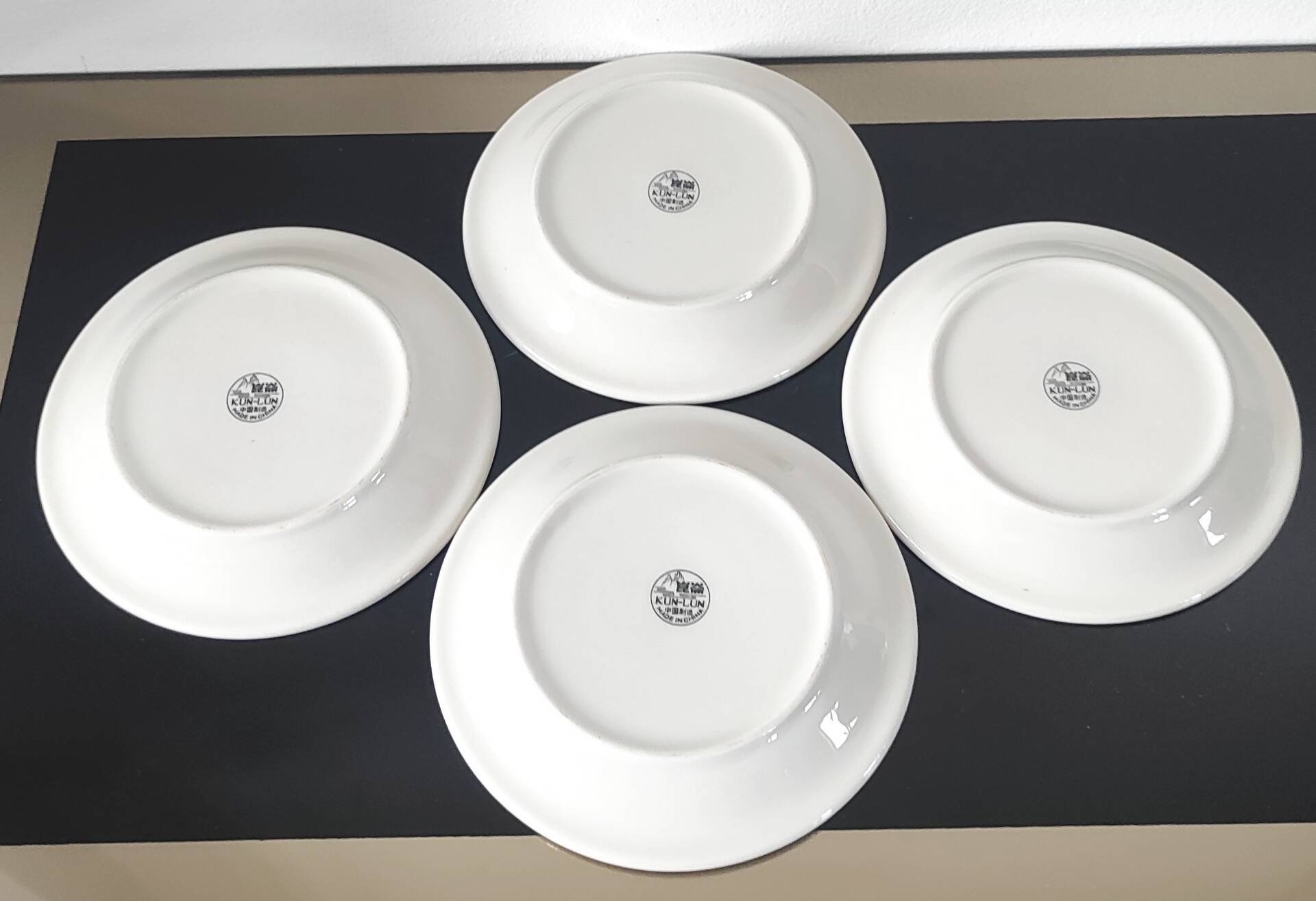Set of small plates, vintage saucers in porcelain.