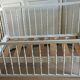 White-bar baby cot