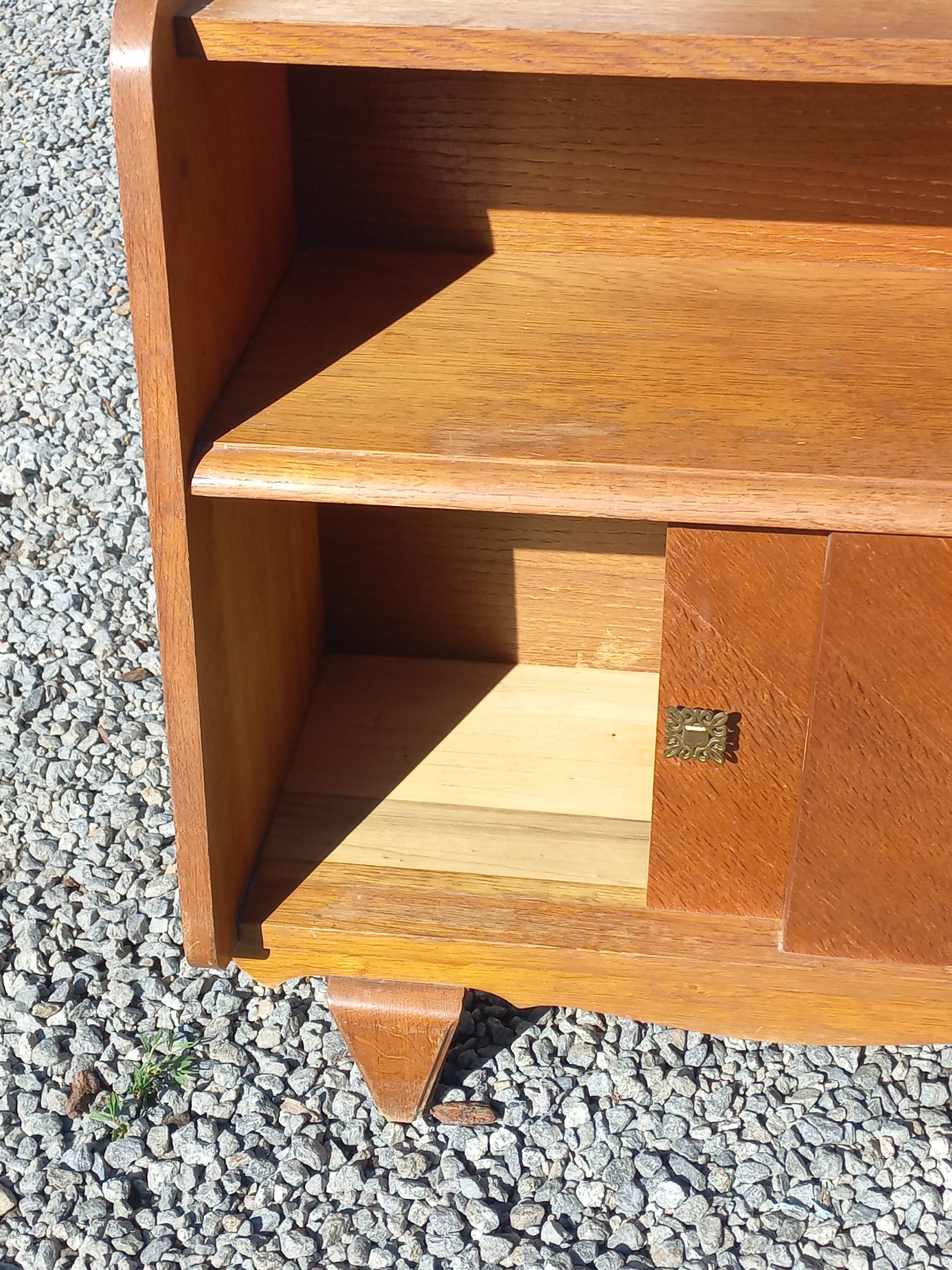 Vintage accent furniture in golden blonde oak with 2 sliding doors.