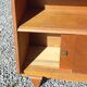 Vintage accent furniture in golden blonde oak with 2 sliding doors.