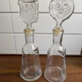 Pair of decanters by Erik Hoglund for Neiman Marcus, "People" series, Kosta Boda