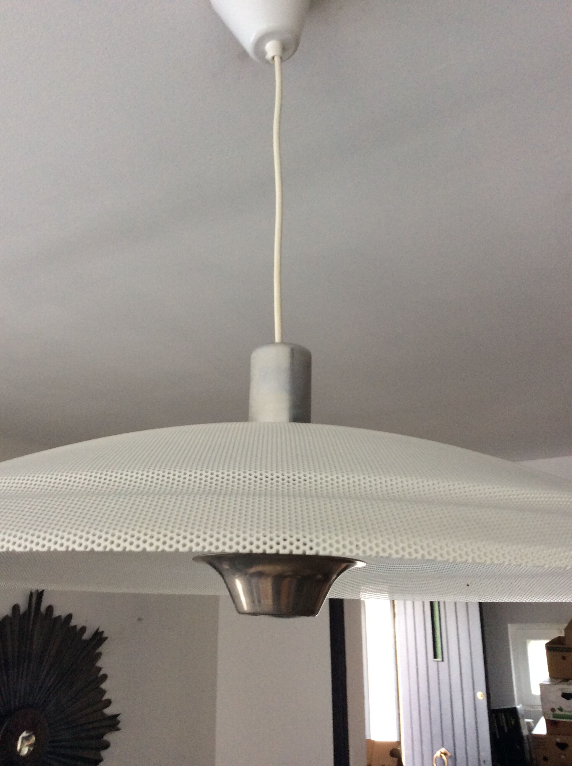 Suspension of the 70s in perforated metal