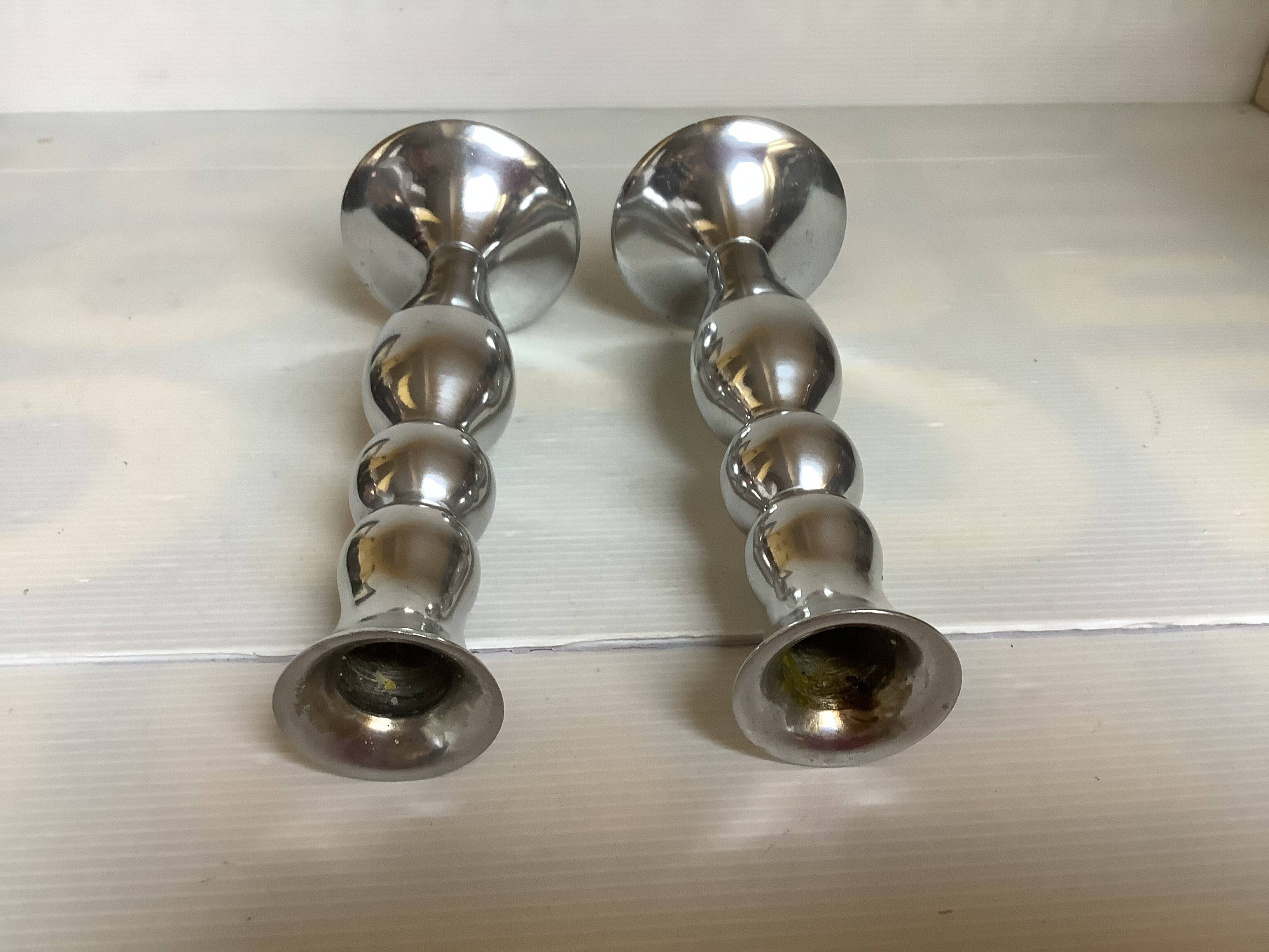 Pair of silver metal candlesticks