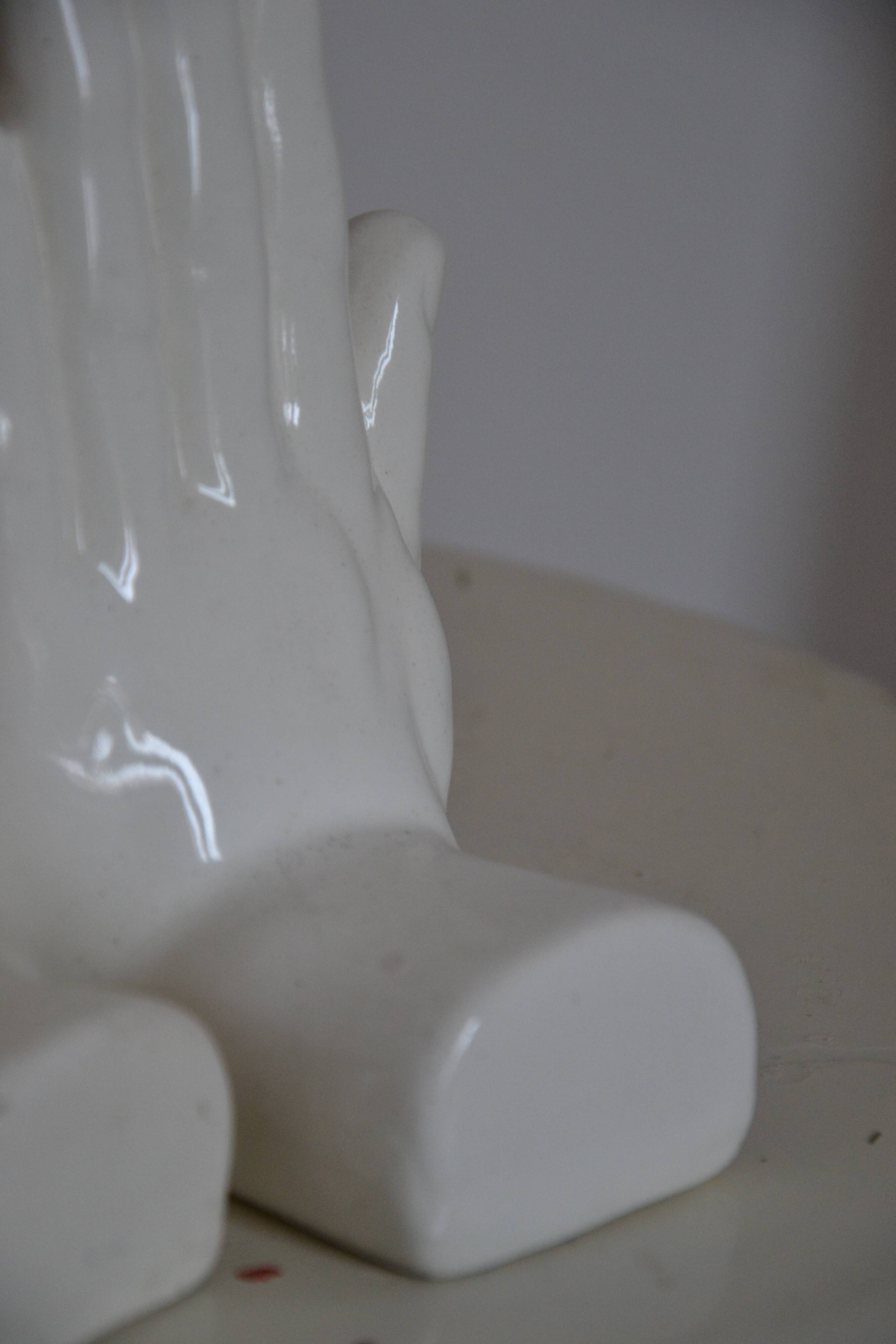 Handends in the shape of vintage white ceramic