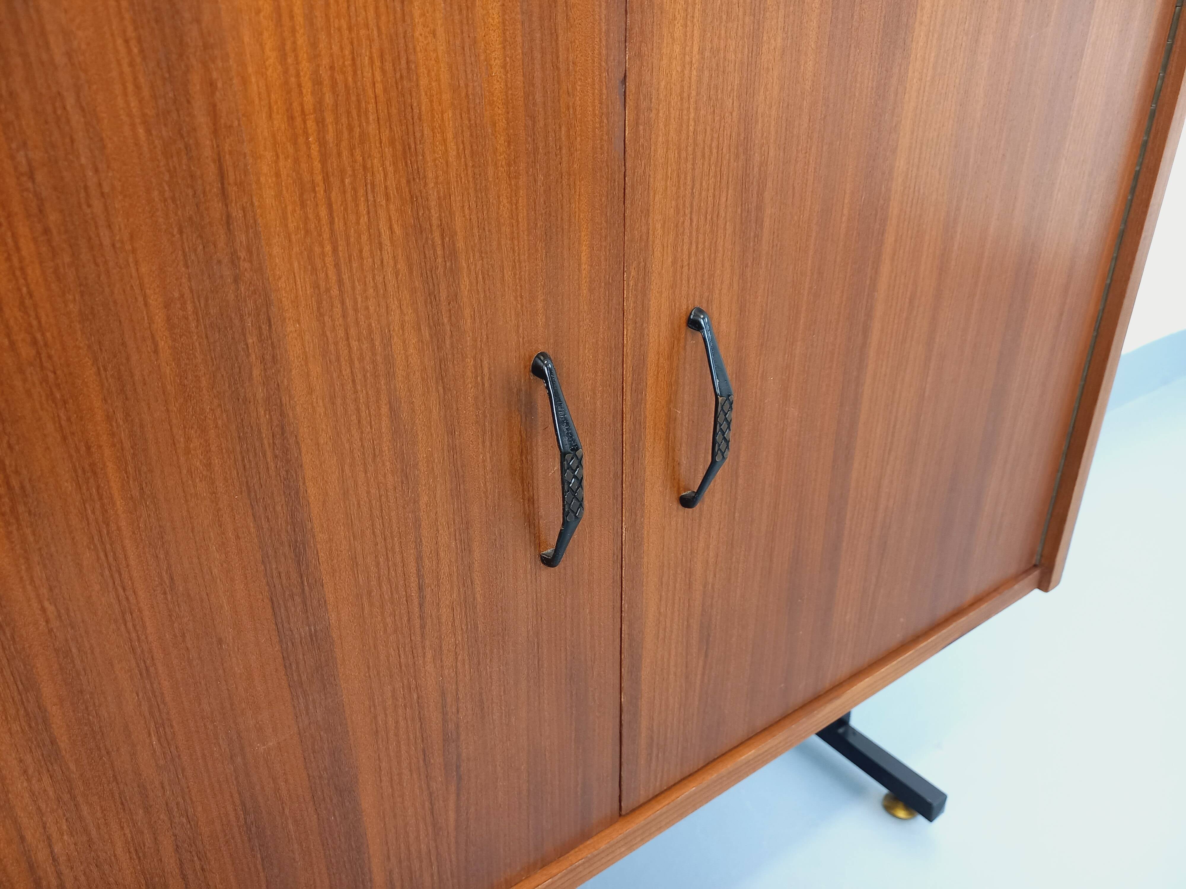Vintage modular secretary bookshelf in teak and metal.