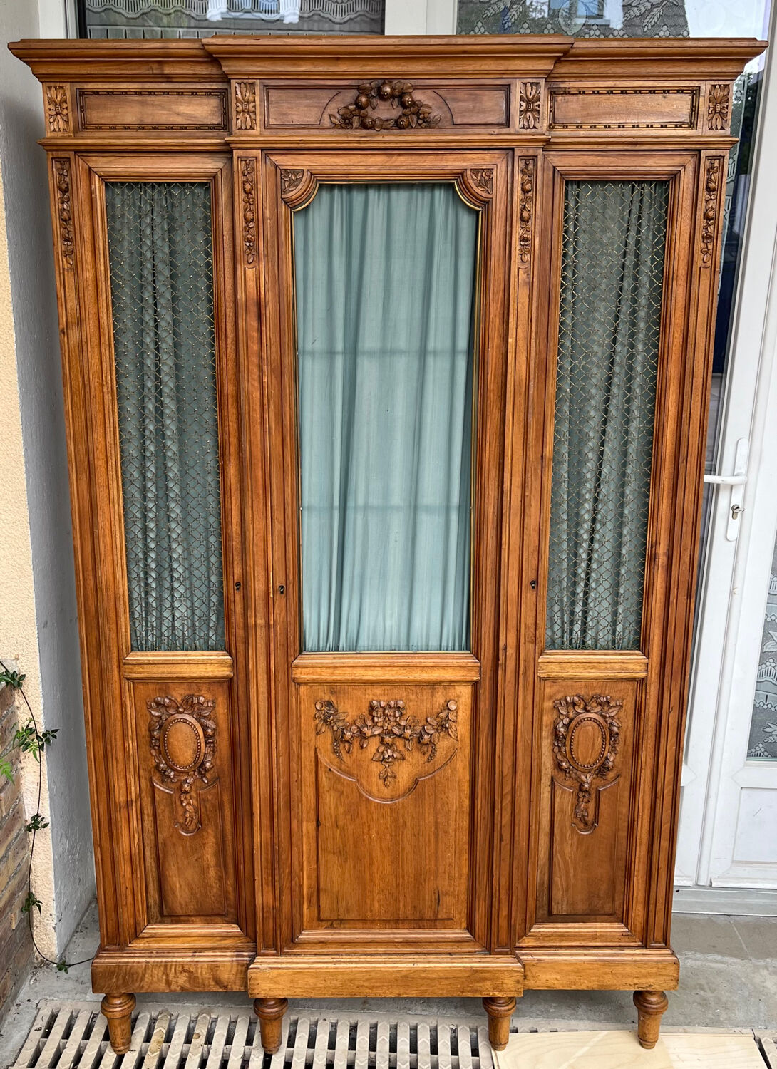 Antique carved wooden bookcase