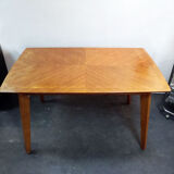 Dining table with compass feet