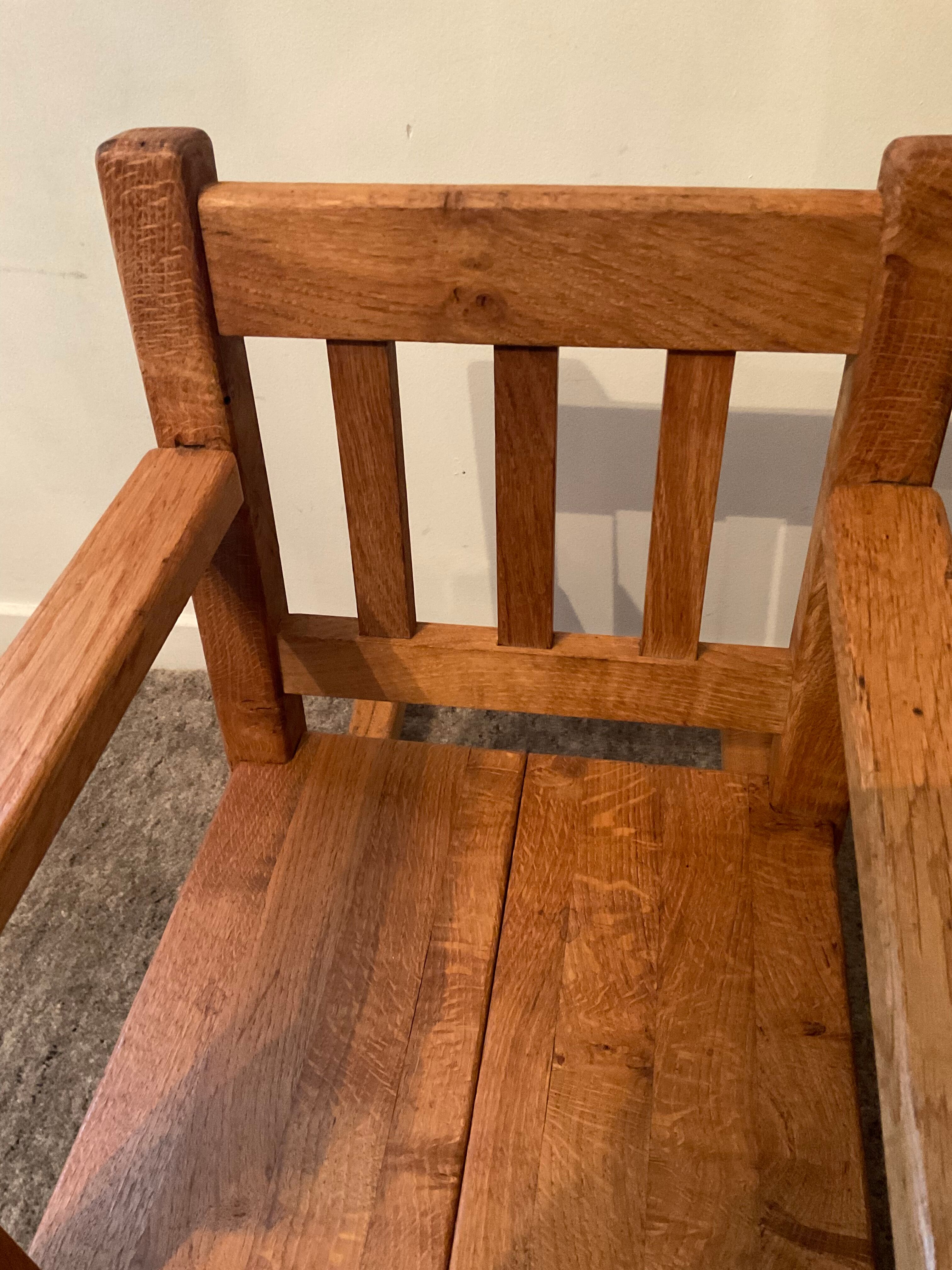 Old children's rocking chair in solid wood