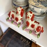 Pair of Staffordshire porcelain Cavalier King Charles dogs on terrace, 19th century.