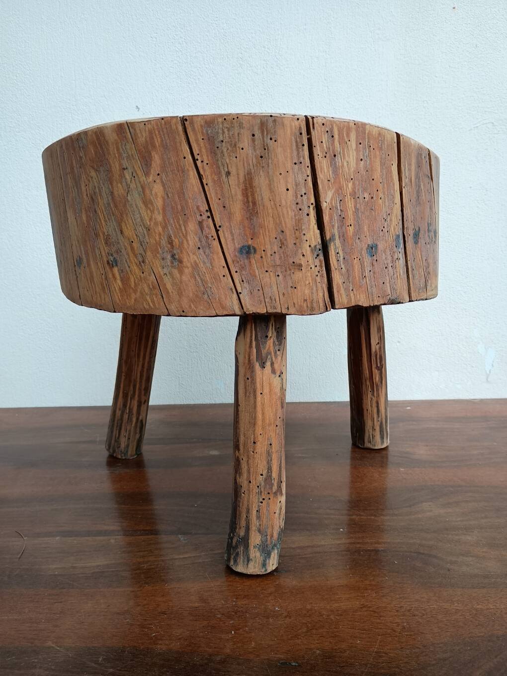 Brutalist tripod coffee table in solid wood.
