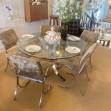 Round glass dining table, circa 1970.