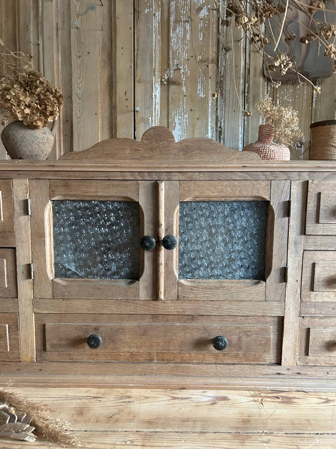 Small piece of furniture with glass doors and drawers