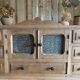 Small piece of furniture with glass doors and drawers