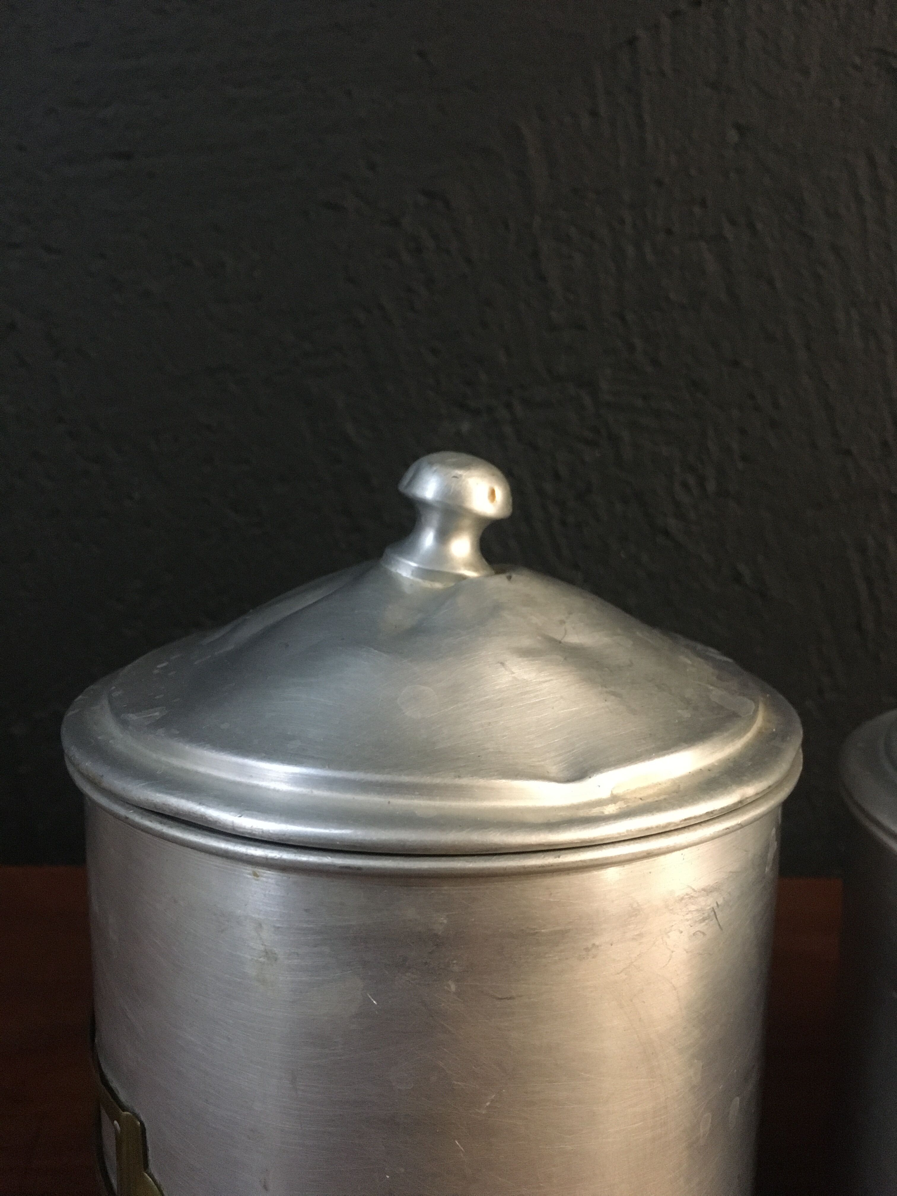 Six aluminum spice pots