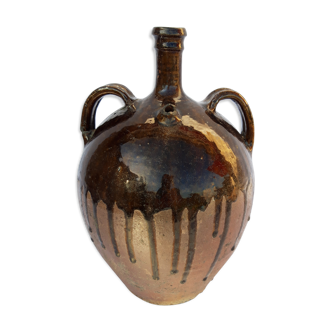 Old glazed earth jug