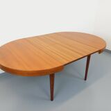 Large vintage Scandinavian round table from the 50s 60s in teak with extensions