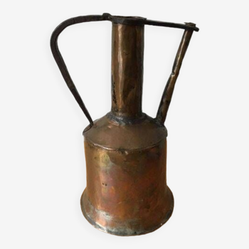 Old copper jug or water pot with wrought iron handle