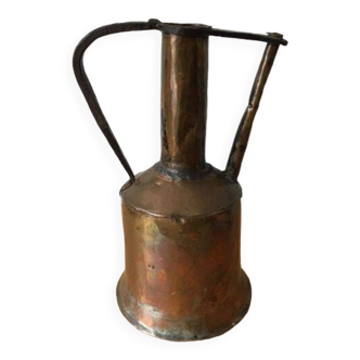 Old copper jug or water pot with wrought iron handle