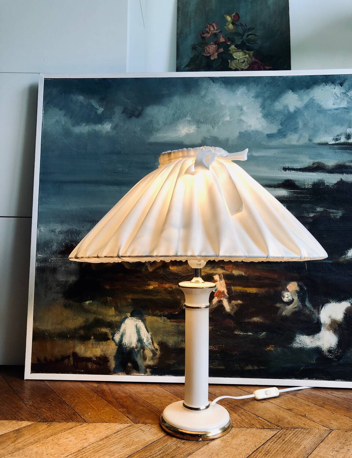 Vintage ivory ceramic lamp with gilding.