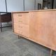 Danish buffet in light oak with sliding door and four drawers.