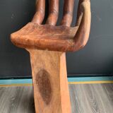 Hand-shaped carved wooden stool