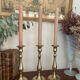 Set of three vintage brass candlesticks