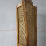 Handcrafted screen in exotic wood and rope.