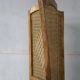 Handcrafted screen in exotic wood and rope.