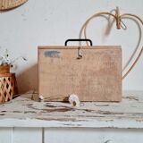 Small trunk in old wooden chest